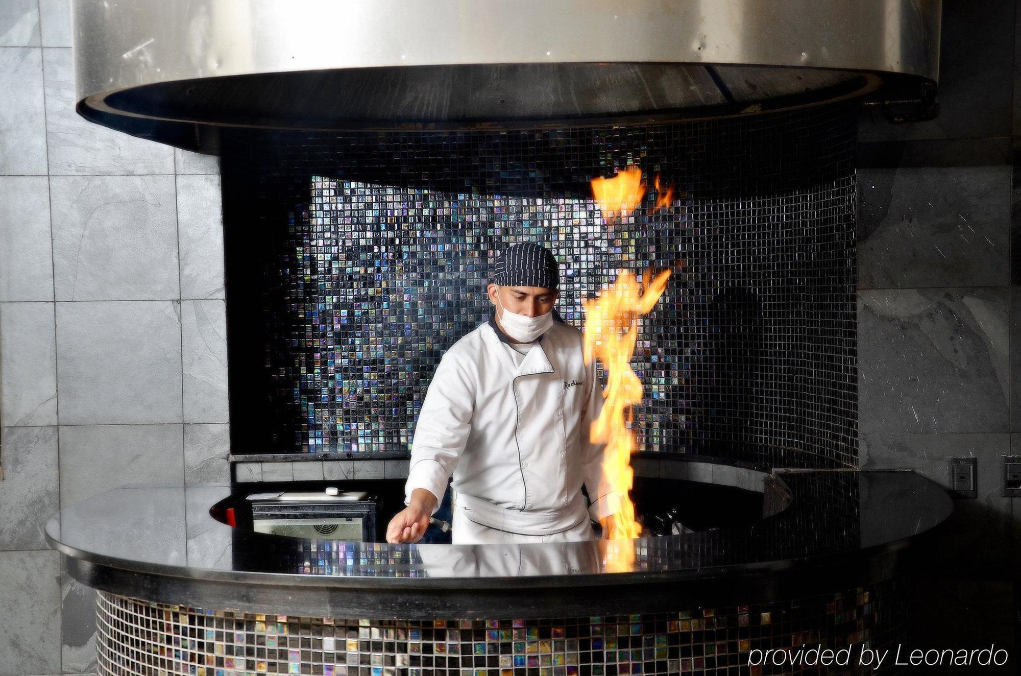 Nh Cali Royal Hotell Restaurant bilde